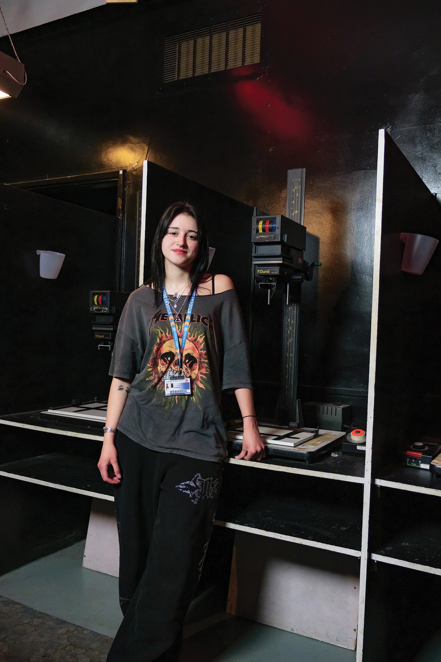 Female student in dark room