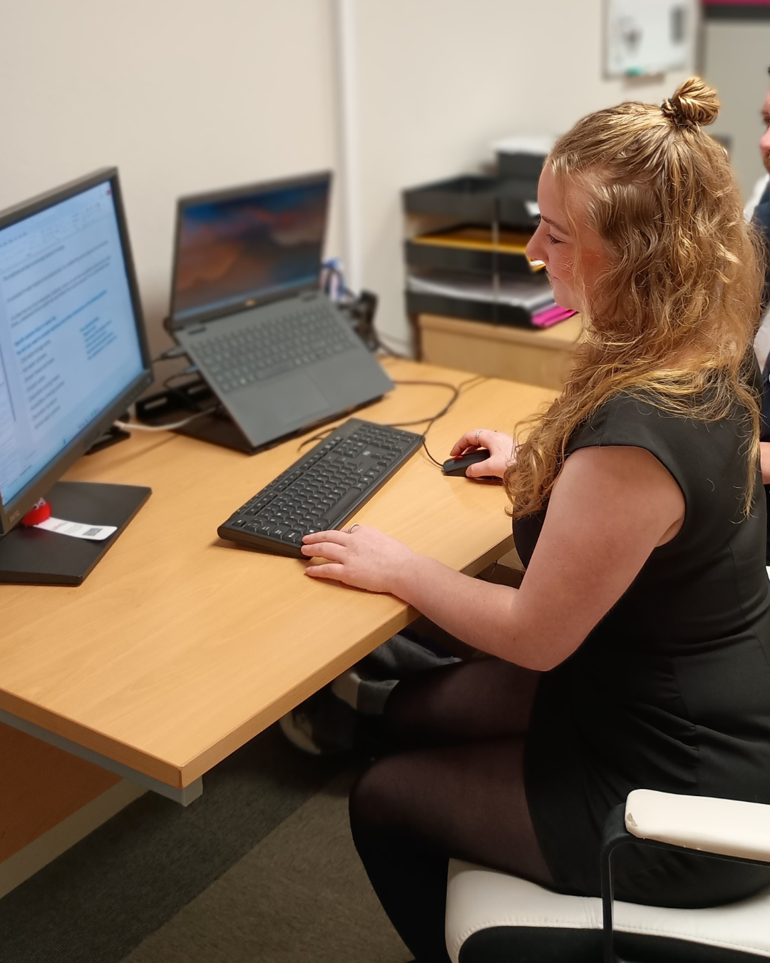 Student sat at desk looking at computer